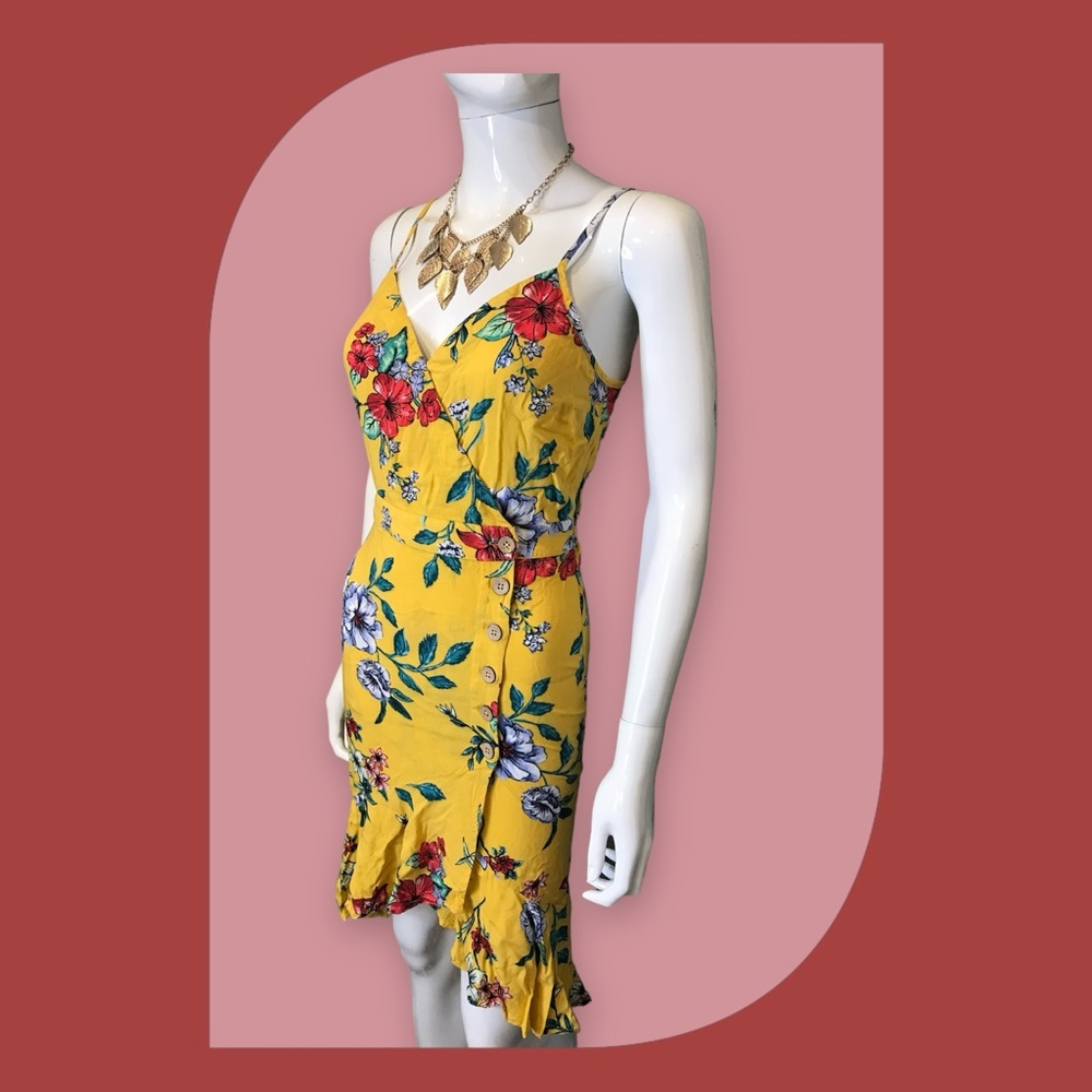 Xhilaration size Small dress in yellow with colorful flowers and leaves.